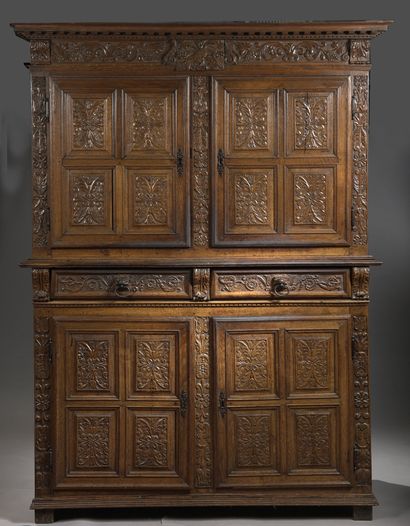 null 
BUFFET IN CABINET with two bodies in moulded and resculpted oak, decorated...