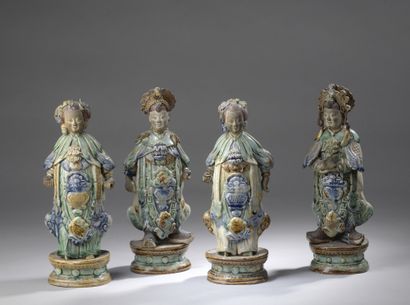 null SET OF FOUR STATUTES in brown, green and blue polychrome enamelled stoneware,...