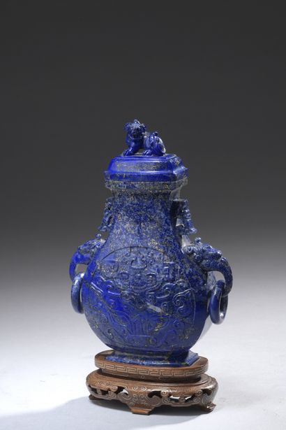 null COVERED VASE of flattened baluster shape in lapis lazuli, the body with carved...