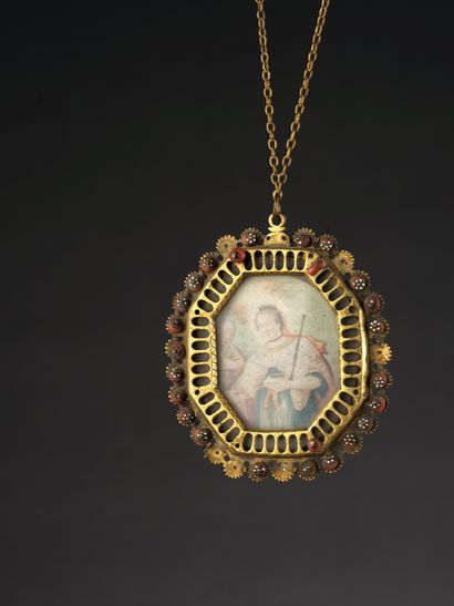 null Octagonal MEDAL in golden brass decorated with coral and enamelled flowers....