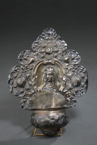 null BENITIER in embossed silver decorated with a bust of the Blessed Virgin, flowers...