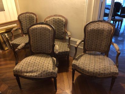 Suite of four convertible armchairs in molded...