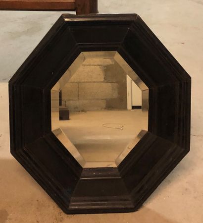 Small octagonal ebony mirror 
54 x 47.5 ...