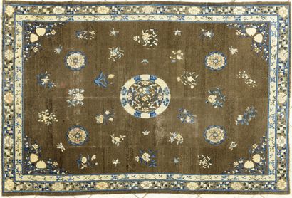  Antique Chinese carpet with a flowery central medallion. Four small medallions and...