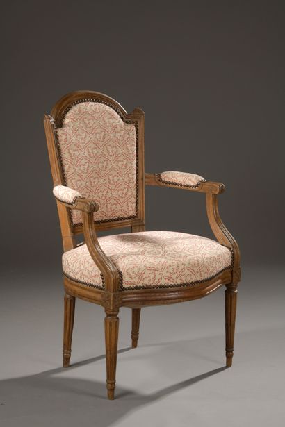 Moulded and carved wooden armchair with gendarme...