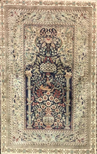  A set of six carpets (wear and tear) including : 
- Silk, red background with floral...