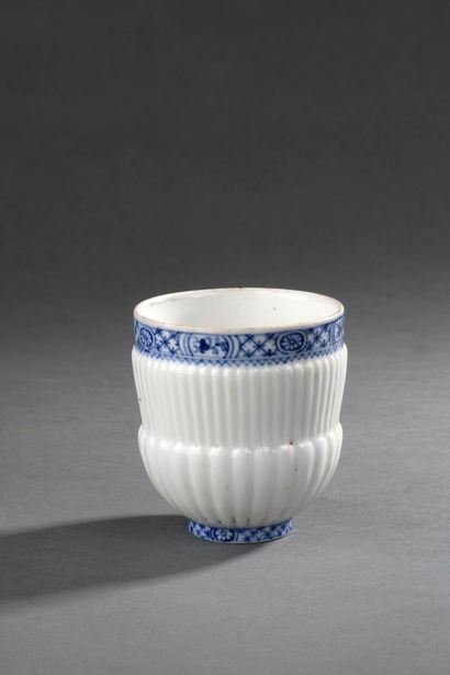 null Soft porcelain cup with gadroons, blue enamelled decoration with friezes, fake...