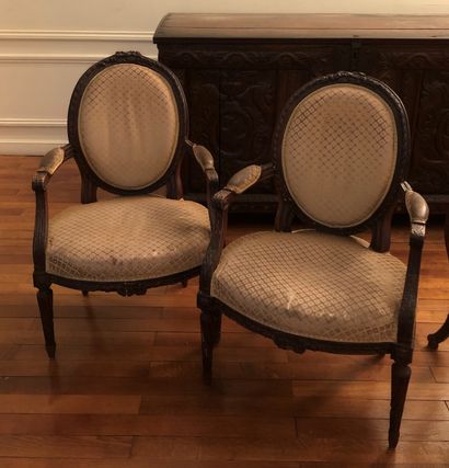 null Suite of four convertible armchairs in molded and carved wood, floral trim at...