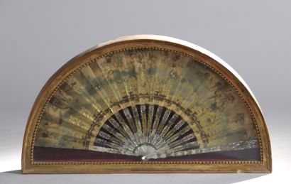 Fan decorated with a frieze of love, the...