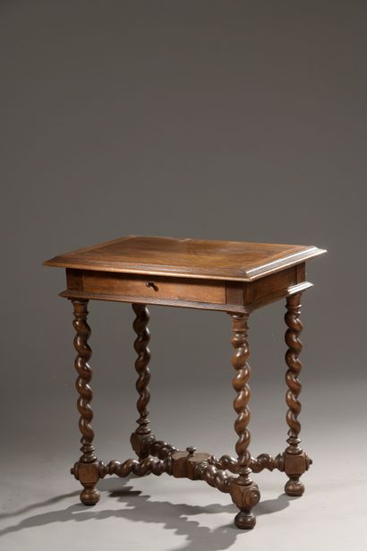 null Louis XIII style table in moulded walnut with a drawer opening by a belt drawer,...