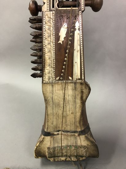 null Sarangi and bow, India

Wood, bone, riveted metal and skin

Small misses and...