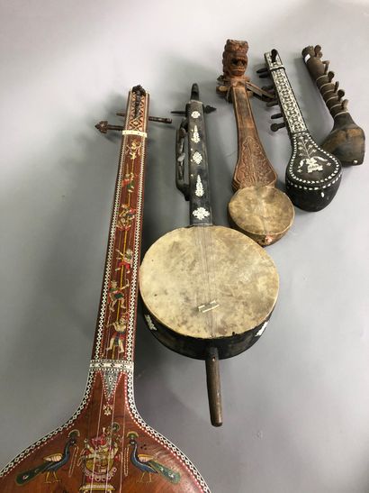 null Four sitars and an Asian string instrument

Wood, bone, skin, one painted.

L:...