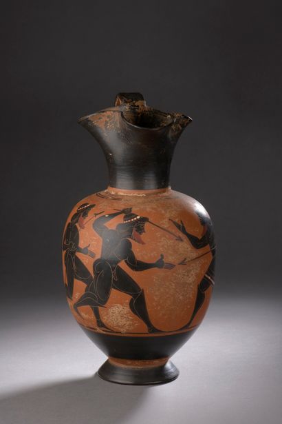 Terracotta jug with black figure decoration...