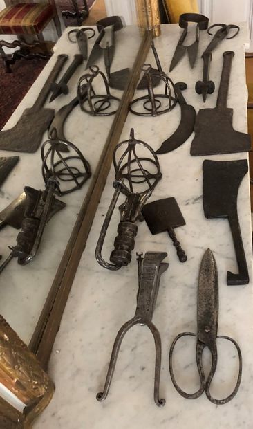  Set of wrought iron and metal tools including: axe, serpent, chisel, scissors, stirrups...