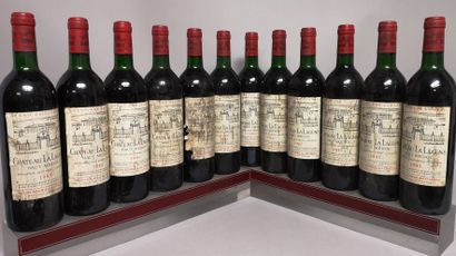 null 12 bouteilles Château LA LAGUNE - GCC Haut-Médoc 1985 

Etiquettes tachées et...