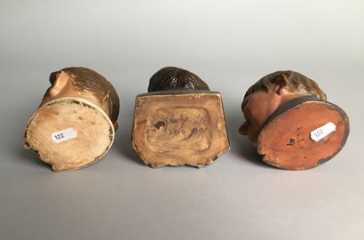 null Lot of 9 tobacco pots including : 

- Head of a mustachioed man, smiling, with...