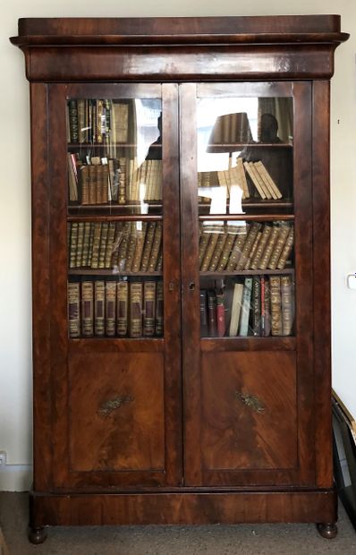 null A Louis Philippe period mahogany and mahogany veneer bookcase, opening with...