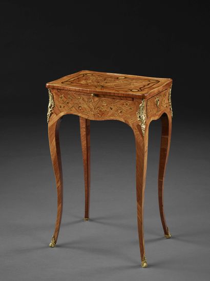null Louis XV period writing table

In exotic wood veneer and floral marquetry, decorated...