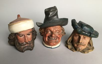 null Lot of 9 tobacco pots including : 

- Head of a mustachioed man, smiling, with...