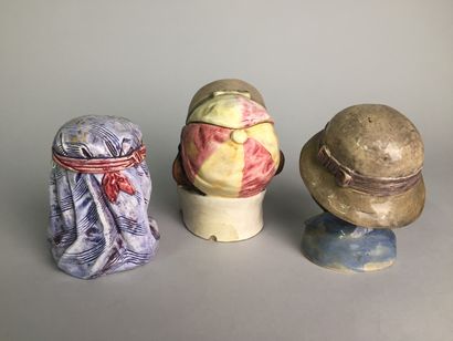null Lot of 9 tobacco pots including : 

- Head of young Arab smiling with his keffiyeh.

Glazed...
