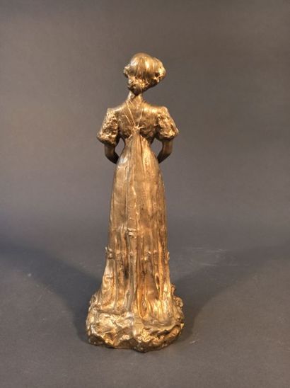 null Bronze subject with gold patina representing a young elegant woman with an open...