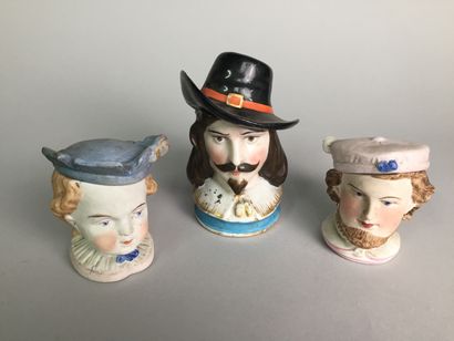 null Lot of 8 tobacco pots including : 

- Head of a 17th century character, with...