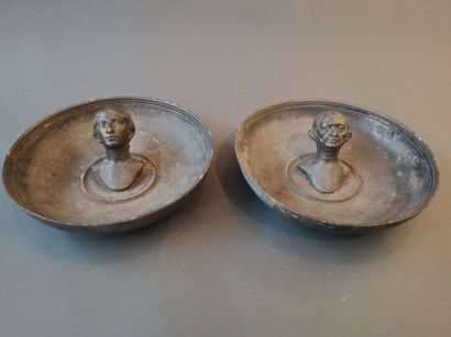 null Two pewter emblema cups. Decorated in high relief with a male and a female bust...