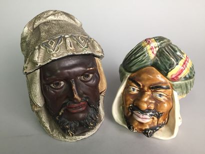null Lot of 7 tobacco pots including : 

- Head of an Arab chief, bearded and mustachioed,...