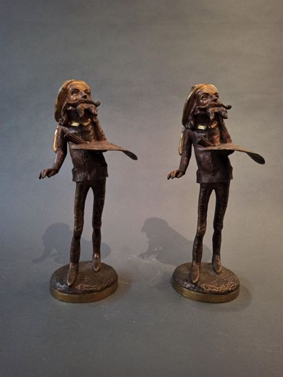 null Two bronze candlesticks representing a painter with a palette in the taste of...