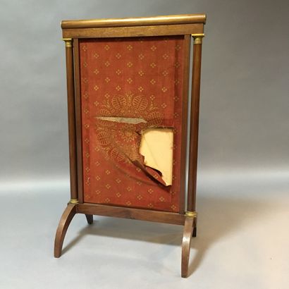 null Varnished wood and gilt bronze fire screen. 

19th century

Accident to the...