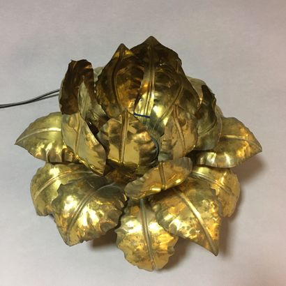 null Lamp in the shape of a lotus flower made of brass leaves fixed on a square base...
