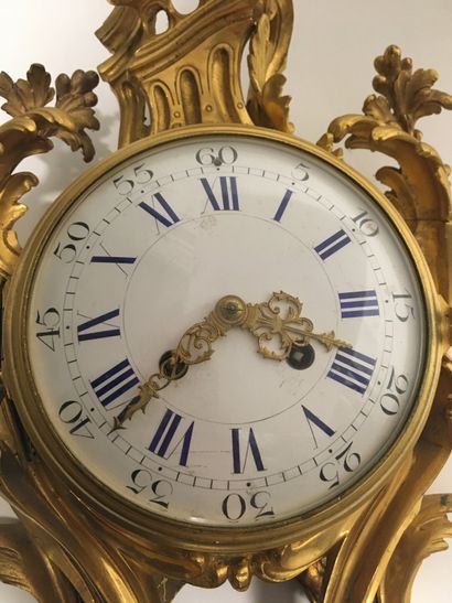 null Gilt bronze wall clock of Rocaille shape, enamelled dial

Louis XV style

With...