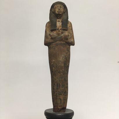 null Painted wooden oushebti. 

Egypt, New Kingdom

Small damages, accidents and...