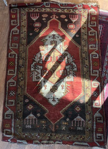 null Two oriental woolen rugs with geometrical patterns and red background 

Wear,...