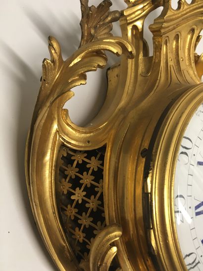 null Gilt bronze wall clock of Rocaille shape, enamelled dial

Louis XV style

With...