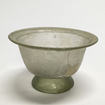 null A slightly conical glass bowl with a neck decorated with "pinched", on a pedestal....