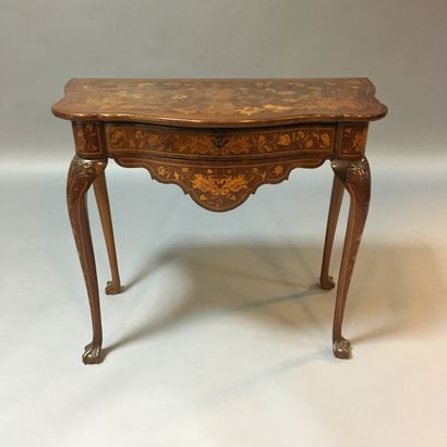 Console table in inlaid wood, the top decorated...
