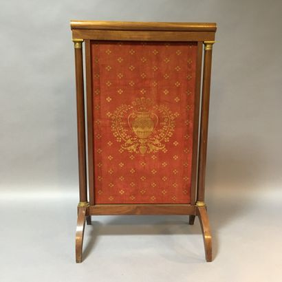 null Varnished wood and gilt bronze fire screen. 

19th century

Accident to the...