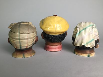 null Lot of 9 tobacco pots including : 

- Head of a bearded bourgeois with hat and...