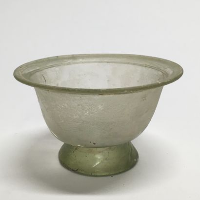 null A slightly conical glass bowl with a neck decorated with "pinched", on a pedestal....