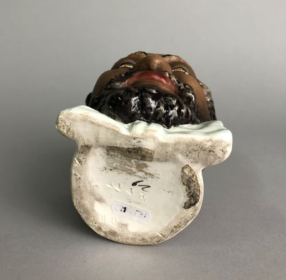 null Smiling Turk head with fez and bow tie. 

Glazed earthenware

N°4447-29

nineteenth...