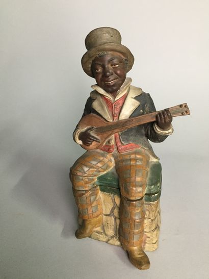 null Jeune musicien de la Nouvelle Orléans jouant du banjo, tout en riant, assis...