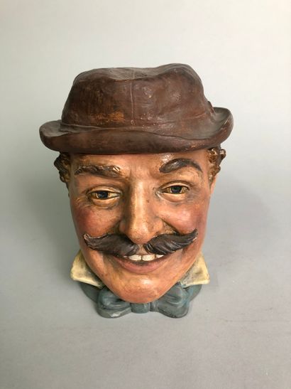 null Moustached man's head, smiling, with a deformed hat. 

Painted terracotta

NO....