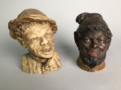 null Head of a man with negroid features, smiling, in a peasant's shirt and headdress.

Patinated...