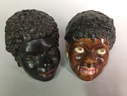 null Head of black, frizzy hair, with earrings. 

Painted terracotta 

No. U and...