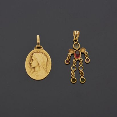 null Lot comprising:

- an 18K yellow gold 750‰ medal, oval in shape with the effigy...