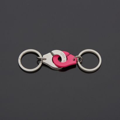 null * DINH VAN - Keychain in the form of handcuffs, one pink titanium and the other...