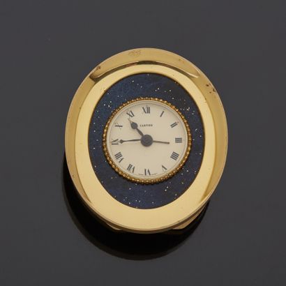 null Lot including : 

- CARTIER - Gilt metal and imitation lapis lazuli alarm clock,...