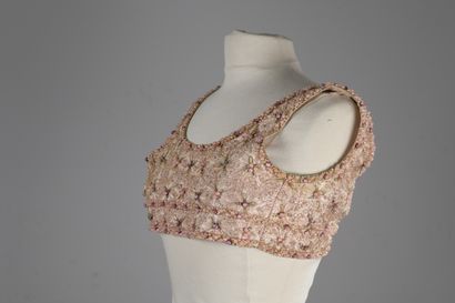 null GIVENCHY, attributed to

Pale pink satin bra top, embroidered with pearls and...