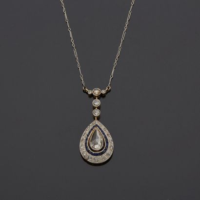 null 18K yellow gold 750‰ and platinum 850‰ necklace, adorned with a pear-shaped,...